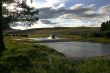 car, river and cloudy sky