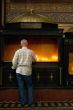man with candle in churche