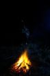Person sitting near of a fire