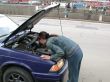 girl repairs car
