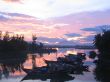 Boats in mooring at sunset