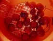 Cherries in sieve