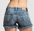 Girl in blue jeans short shorts isolated