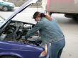 girl repairs car