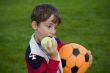 Boy with apple and ball