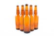 five dark bottles of beer