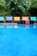 Deck chairs next to a pool