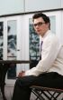 Businessman sitting outside at a table