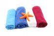 Colorful towels and orange starfish