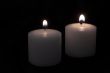 candles burning in a dark room