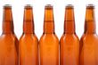 five bottles of beer isolated on white
