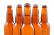 five bottles of beer isolated on white