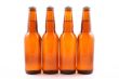 four bottles of beer isolated on white