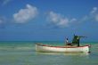 Fisherman in its boat, during an afternoon end