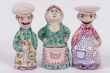 two saltshakers and  mustard-pot
