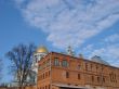 Cathedral red brick wall under deep blue sky