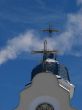 Church Crosses inside white cloud on blue sky