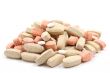 pile of various pills isolated on white