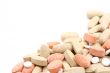 pile of various pills isolated on white