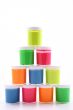 stack of colorful paints close-ups isolated