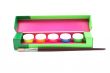 box of colorful paints and brush isolated on white