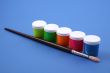 colorful paints close-ups blue background