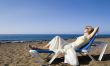 a woman resting on the beach