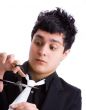Young man cutting his tie