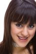 Beautiful young brunette with brackets on teeth 2