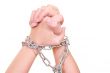 two hands with chain isolated on white