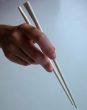 Hand With Chopsticks