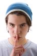 Boy with finger on mouth