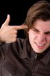 Boy with finger on face
