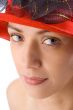 Girl with red hat close-up