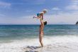 Ma with child on beach