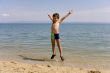 Child jump on seacoast