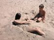 Boy and girl playing in sand