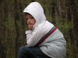 Boy sitting on forest background