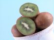 fresh, green kiwi in big cup