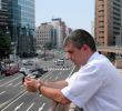 Man with mobile phone in a city