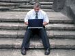 Businessman with laptop outdoor