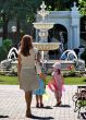 Summer rest in green city park with fountain