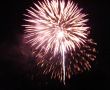 Night celebration fireworks upon dark sky