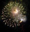 Night celebration fireworks upon dark sky