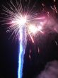 Night celebration fireworks upon dark sky