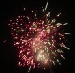 Night celebration fireworks upon dark sky