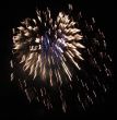 Night celebration fireworks upon dark sky