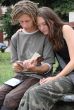 Young stydents reading in street