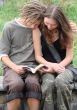 Young stydents reading in street
