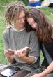 Young stydents reading in street